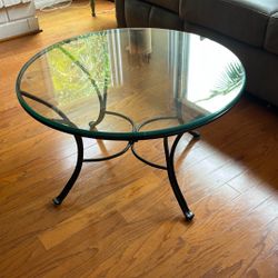 Round glass coffee table.