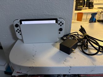 Nintendo Switch OLED Model Console with Dock and Cables.