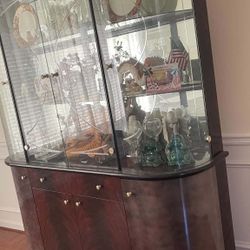 Large Traditional Bow-Front Curio Cabinet with Glass Doors and Storage Base.