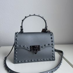 Rockstud Spike Silver Crossbody Rubber Handbag. Removable Strap. Water Resistant Material. New, Never Used.