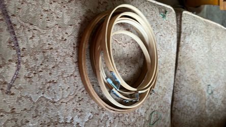 Stack of circular wooden embroidery hoops