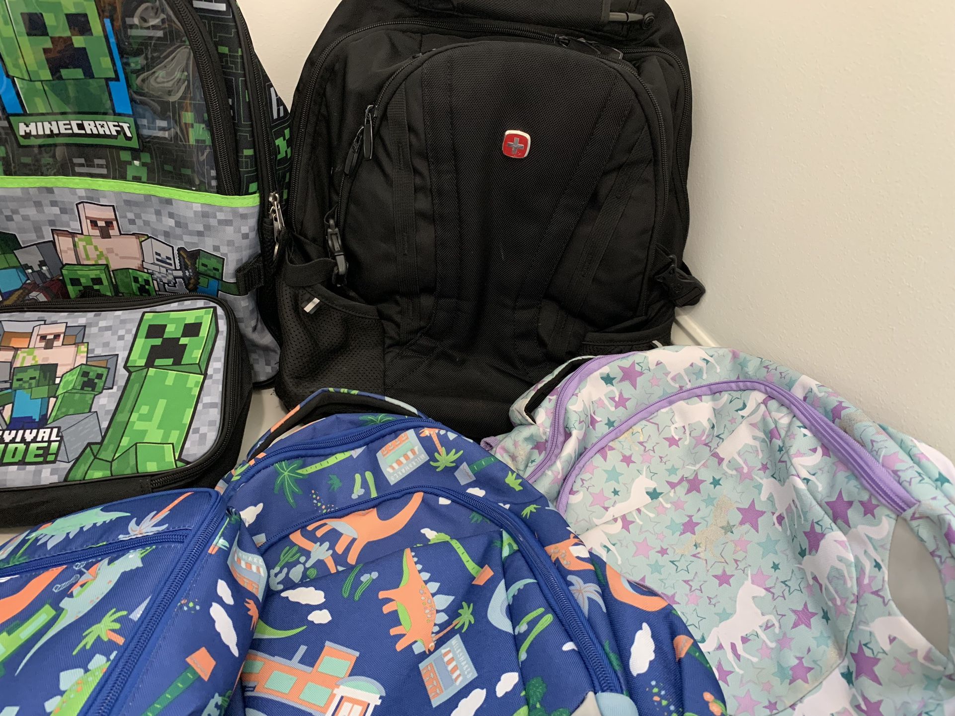 Lots Of Kids School Backpacks And School Lunch Bags