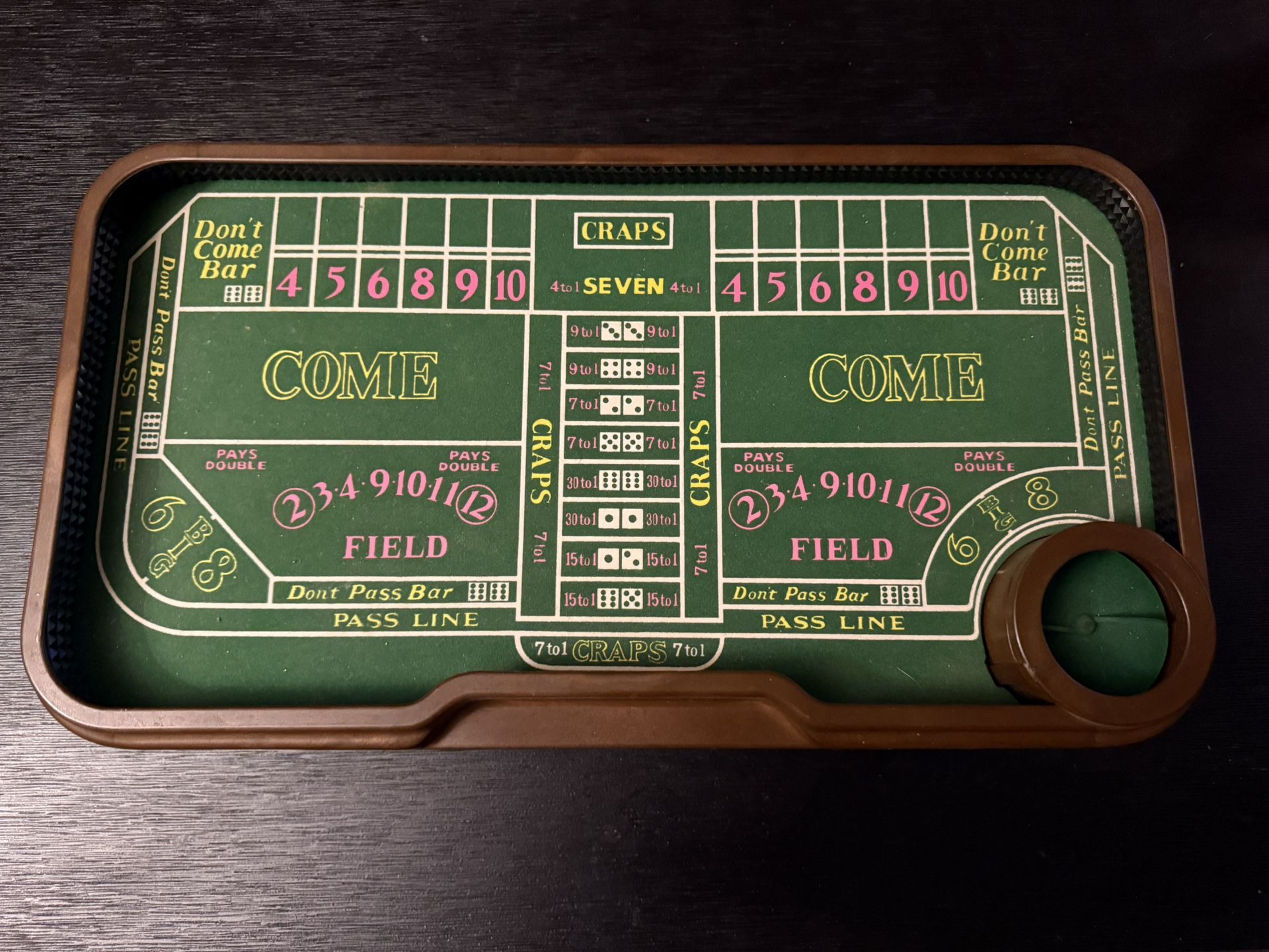 Vintage craps table with automatic dice roller