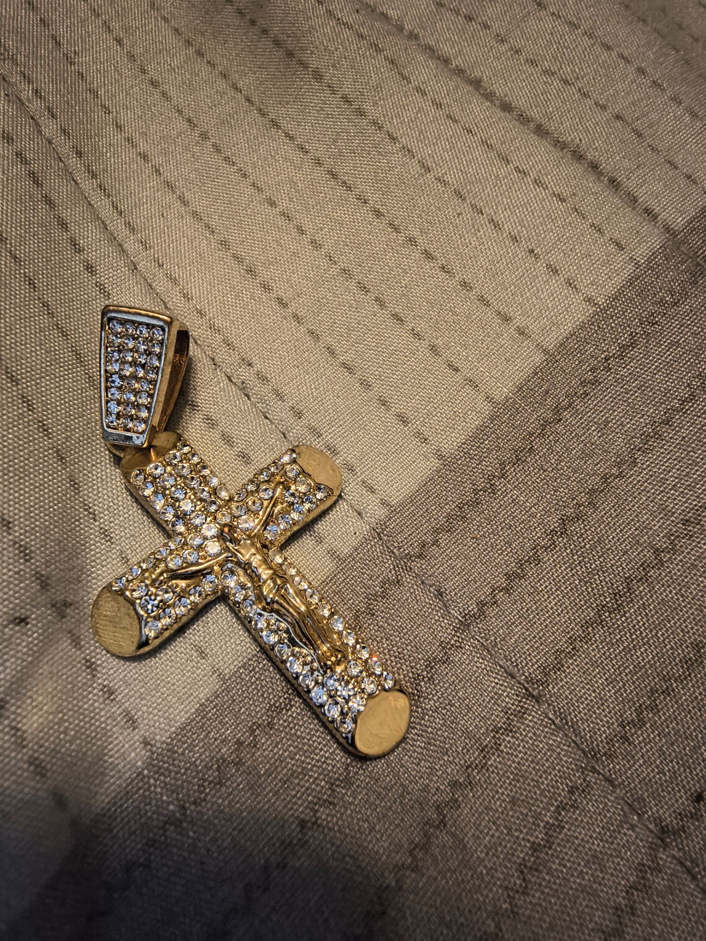 Gold laced iced out diamond pendant.
