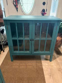 Twin blue cabinets