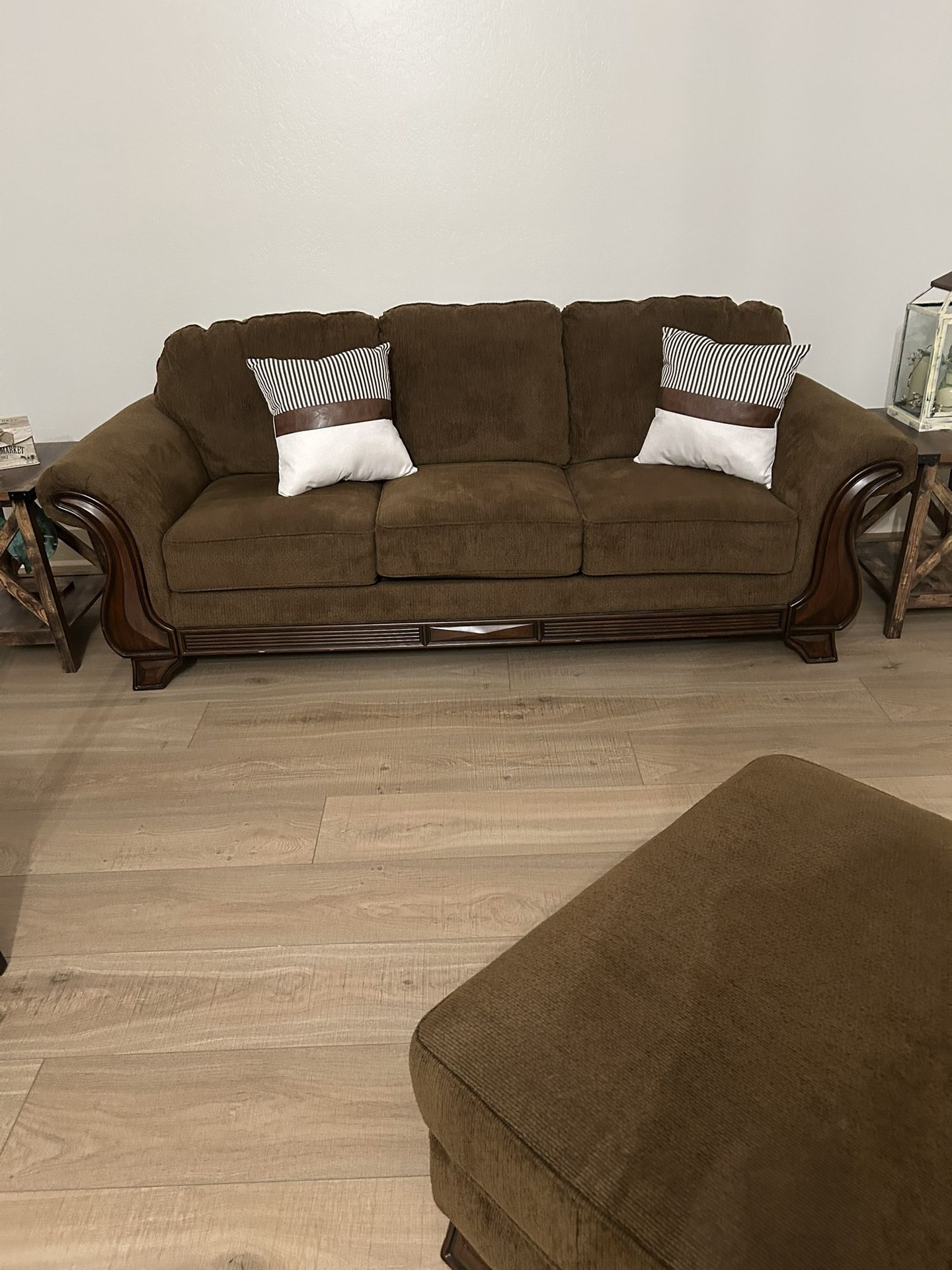 One Brown Couch, One Brown Chair And ottoman