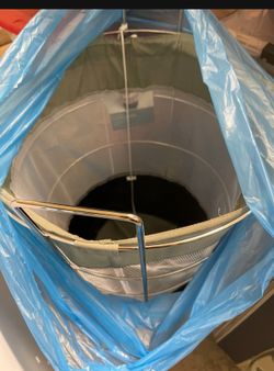 Hamper with fabric lining on wheels