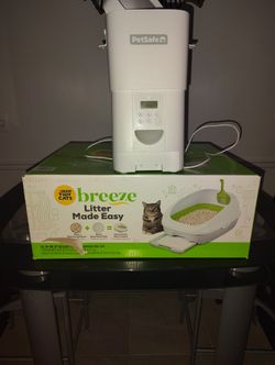 AUTOMATIC DOG FEEDER BRAND NEW AND BRAND NEW BREEZE LITTER MADE EASY