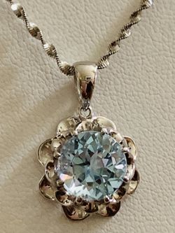 4ct very good cut blue topaz on sterling silver with sterling silver necklace 18”