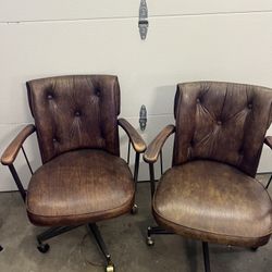 Two Leather Swivel Chairs