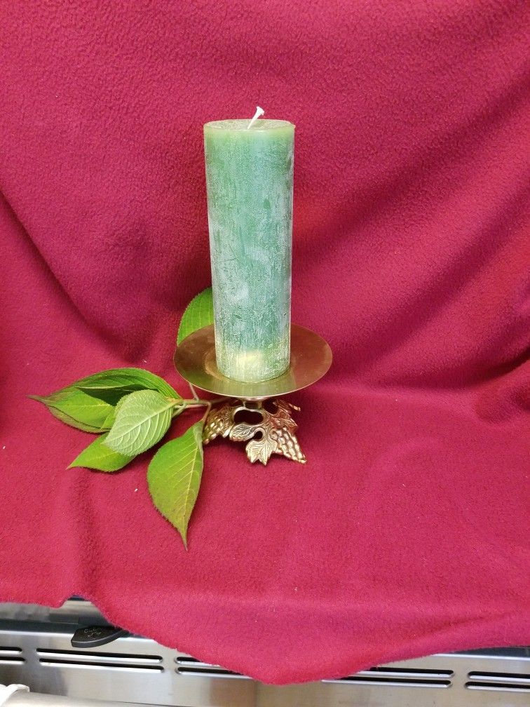 Pillar Candle Atop Vintage Ornate Brass Candle Holder