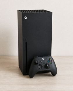 Xbox series X with 2 controllers and charging station