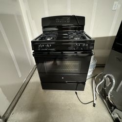 Brand new range, microwave, and dishwasher set