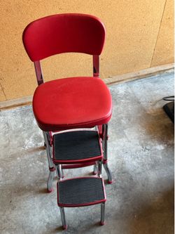 Red chair with extendable step stool