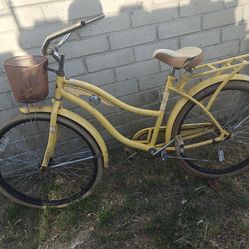 Yellow NEL LUSSO cruiser bike.