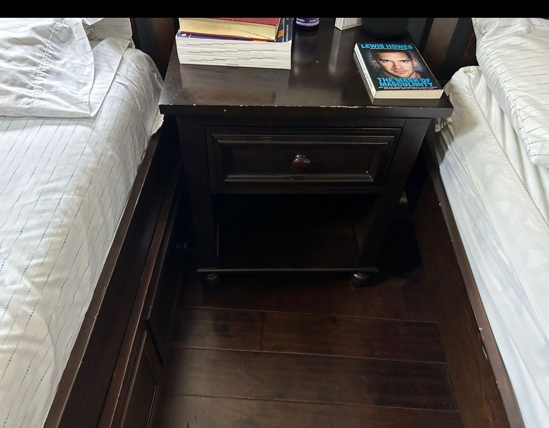 Two Twin Beds With A Night Table