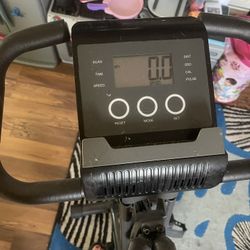 $20 exercise bike machine with digital display. It doesn’t lock into place so it has a bungee cord holds it up to store in up position. Everett pinehu