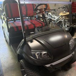 2023 Icon: Matte Black Gold Cart Red Seats Light Bar 