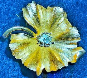 Trifari signed Goldstone rhinestone or Crystal bug pin brooch on a leaf