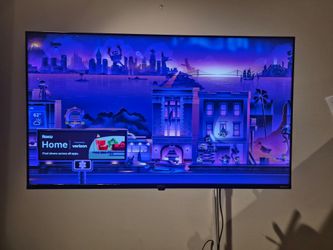 Roku Smart TV WITH Full-Motion Wall Mount".