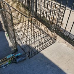42" LONG DOG CAGE(bent on front side) see pictures