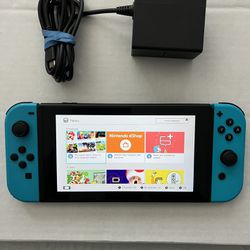 Nintendo Switch System / Console - Works Good - Lots Of Fun - Includes Charger And Game . System has some minor scratches