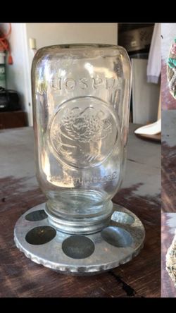 Cute Garden decor. Mason Jar bird feeder also a fun piece for succulents