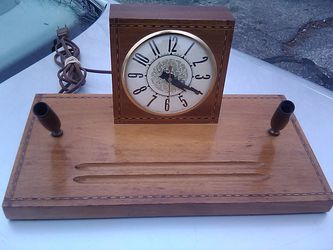 Antique desktop wooden clock with decorative inlay and writing instrument holders