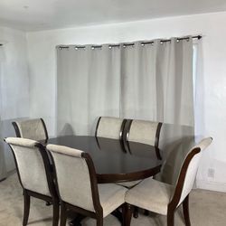 Ashley Furniture Extendable Dining Table & 6 Upholstered Chairs