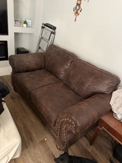 Brown love seat