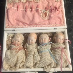 Vintage porcelain doll set in case