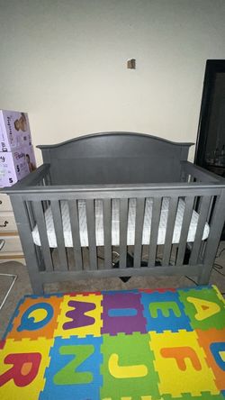 Gray baby crib