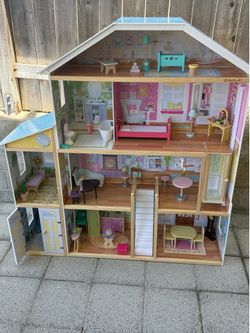 Barbie doll house 4 and a half feet by 4 feet with all furniture.
