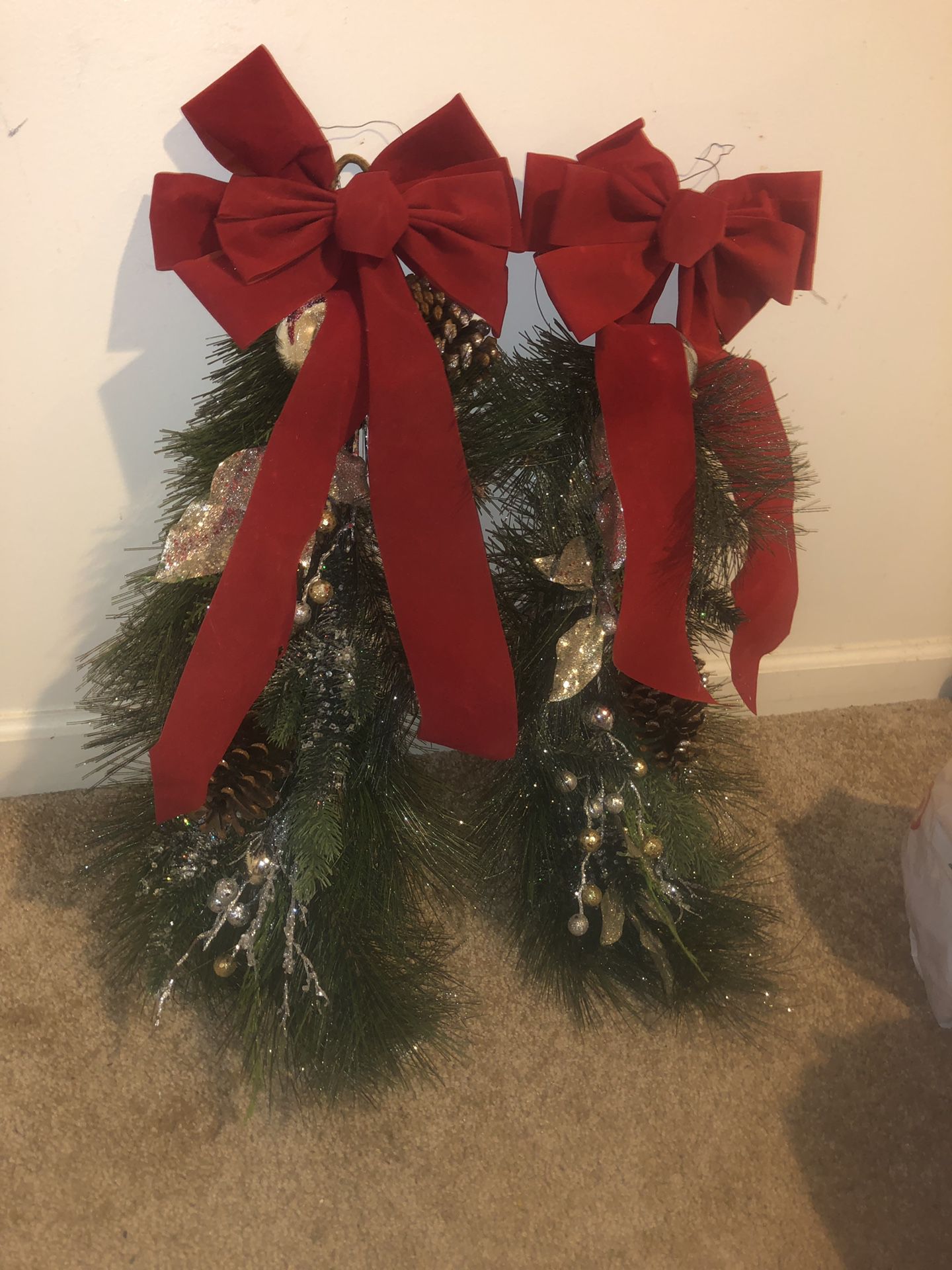 Two foot fake pine branch with red ribbon Christmas decoration