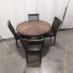 Round Dark Wood Dining Table with Sunburst Veneer