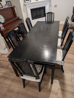 Solid wood black dining table with 2 removable leaf inserts
8 chairs