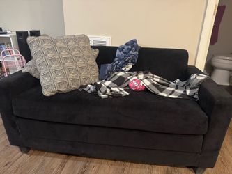 Suede love seat with pull out bed