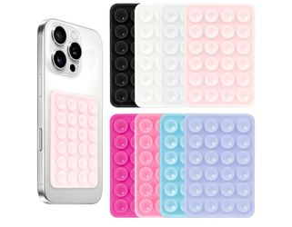 funda o accesorio de silicona tipo "Pop It" para teléfonos móviles, diseñada para aliviar el estrés y proporcionar un agarre cómodo.  This product is