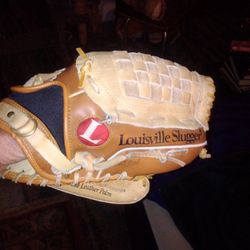 Louisville Slugger Glove With A Rawlings Baseball 