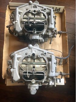 2 Carter thermo quad 4 bbl carburetors