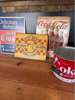 Coca Cola signs and bucket