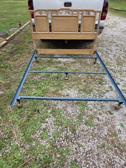 Queen/Full size headboard with metal rails on wheels, headboard is wood and heavy, great condition