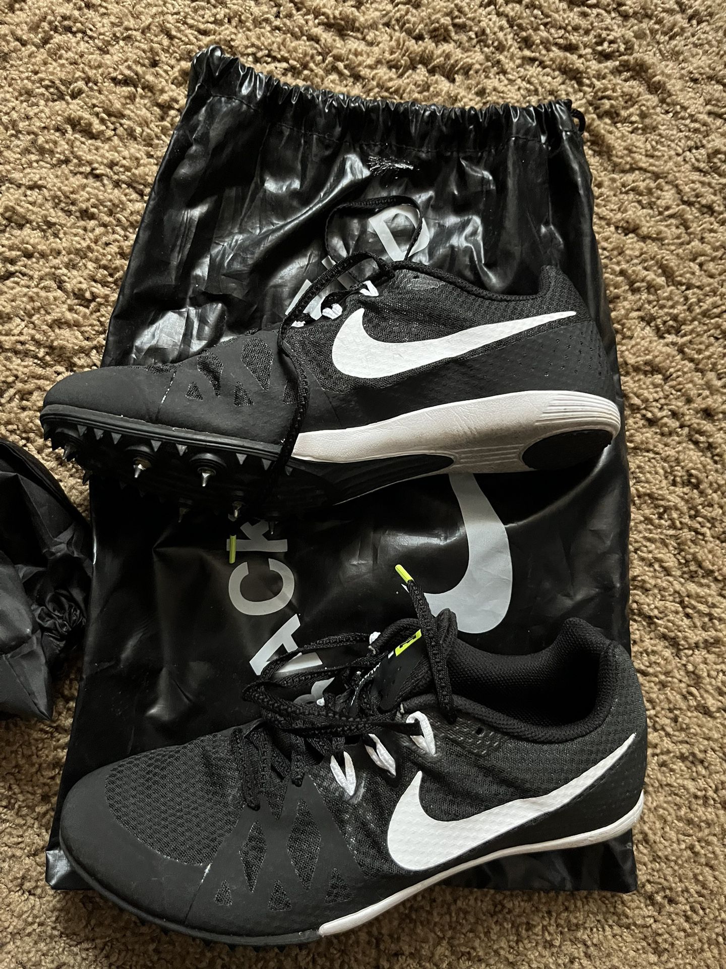 Black Nike track shoes