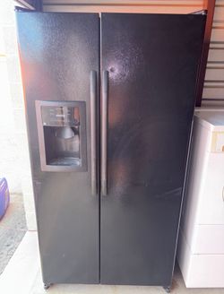 Black GE Refrigerator And Freezer