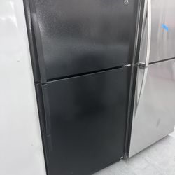Black Top And Bottom Refrigerator Plugged In And Cold 