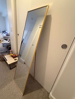 Gold standing mirror