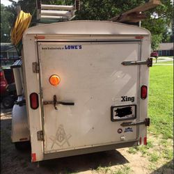 Covered Utility Trailer.  5x8   With Ladder Rack On Each Side   Lights Inside. Plug In I Side  A Couple Shelves Inside 