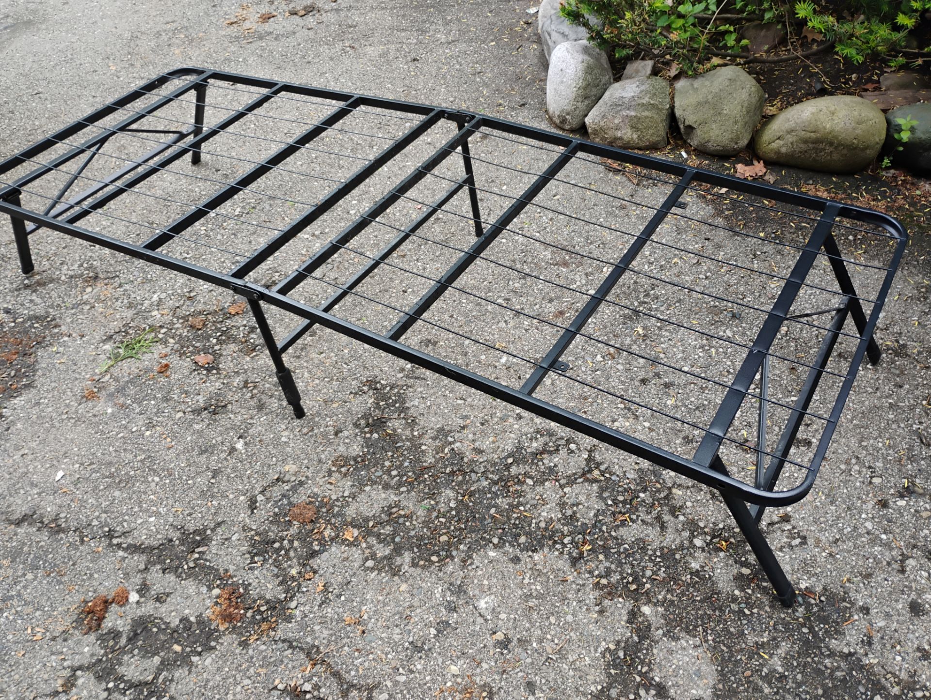 Two portable bed frames