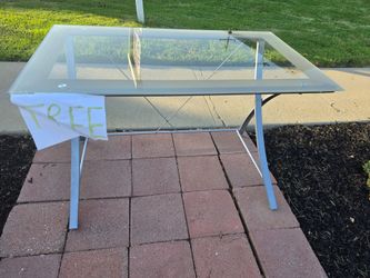 Free glass-top desk. In good used condition, first come first serve. Must pick up.