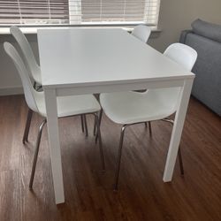Extendable White Dining Table And Chairs